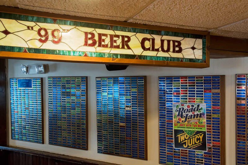 99 Beer Club sign with placards on the wall
